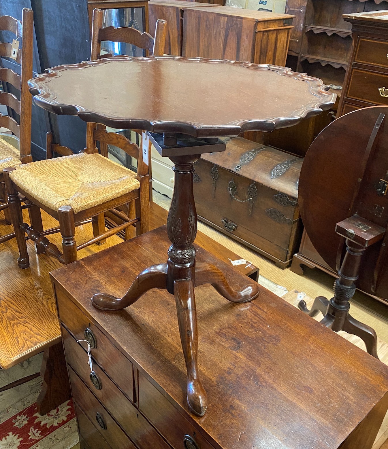 A George III and later circular mahogany tilt top tripod tea table, diameter 61cm, height 69cm